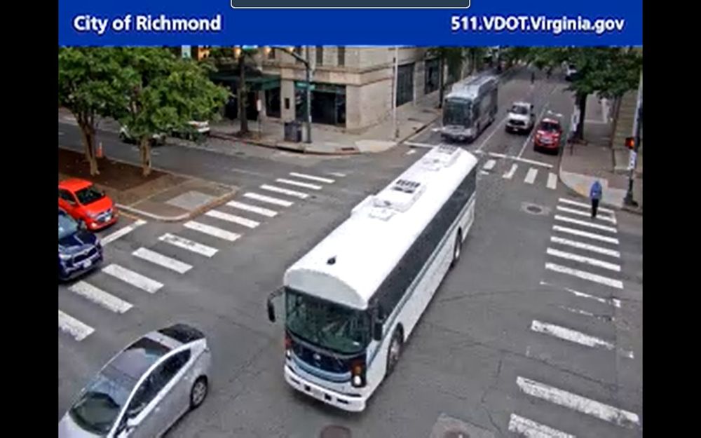 Image from a traffic camera, Richmond, VA, November 2025, shows a thin white bus. It is not painted in the usual GRTC or Pulse colors.