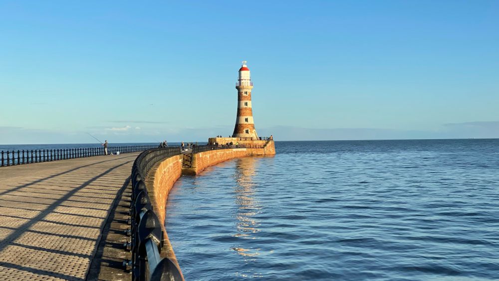 Jetty and lighthouse in a calm tide at Roker