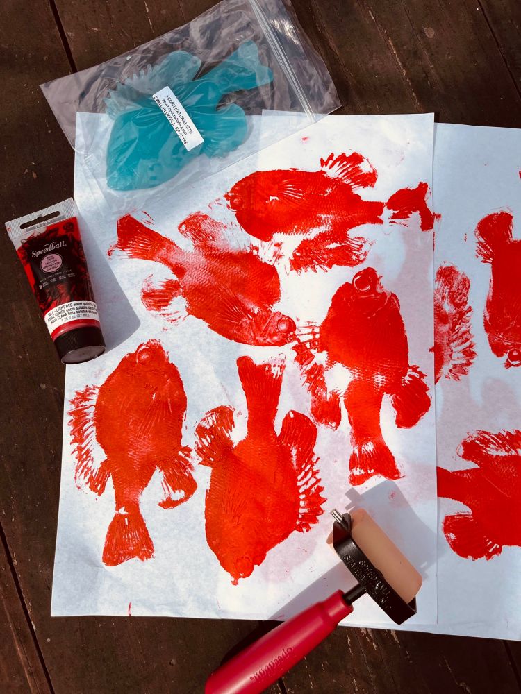 Red block ink, bluegill fish printing, 2-inch brayer, and rice paper with the red gyotaku. 