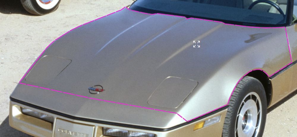 bonnet of the chevrolet corvette c4. it is a clamshell design hidden by the two-tiered bodywork, like layers on a cake.