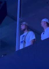 Blurry photo of Travis Kelce in the Mahomes suite at the Kansas City Eras Tour show