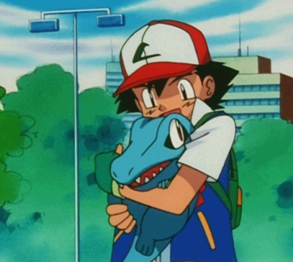 screenshot of ash holding totodile in the Pokémon anime 