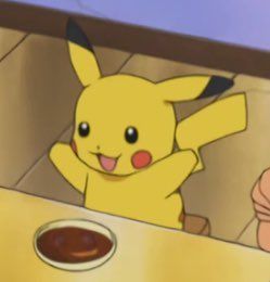 Pikachu from Pokémon excited to eat. He is in a high chair and is about to eat soup from a bowl.