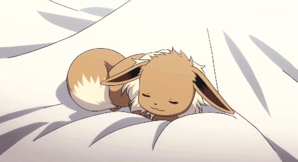 Screenshot of Eevee curled up and sleeping on a bed in the Pokémon anime 