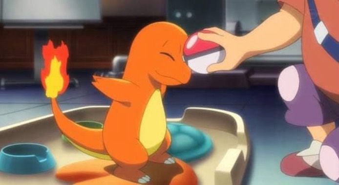 Screenshot of a happy charmander being picked as a starter pokemon in the Pokémon anime 