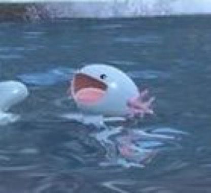 Screenshot of a wooper swimming in a body of water with a big open smile on its face 