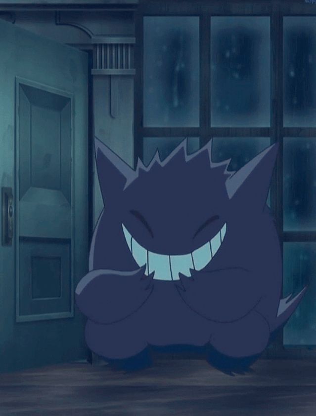 Screenshot of the Pokémon anime showing a Gengar with a big smile on his face laughing 
