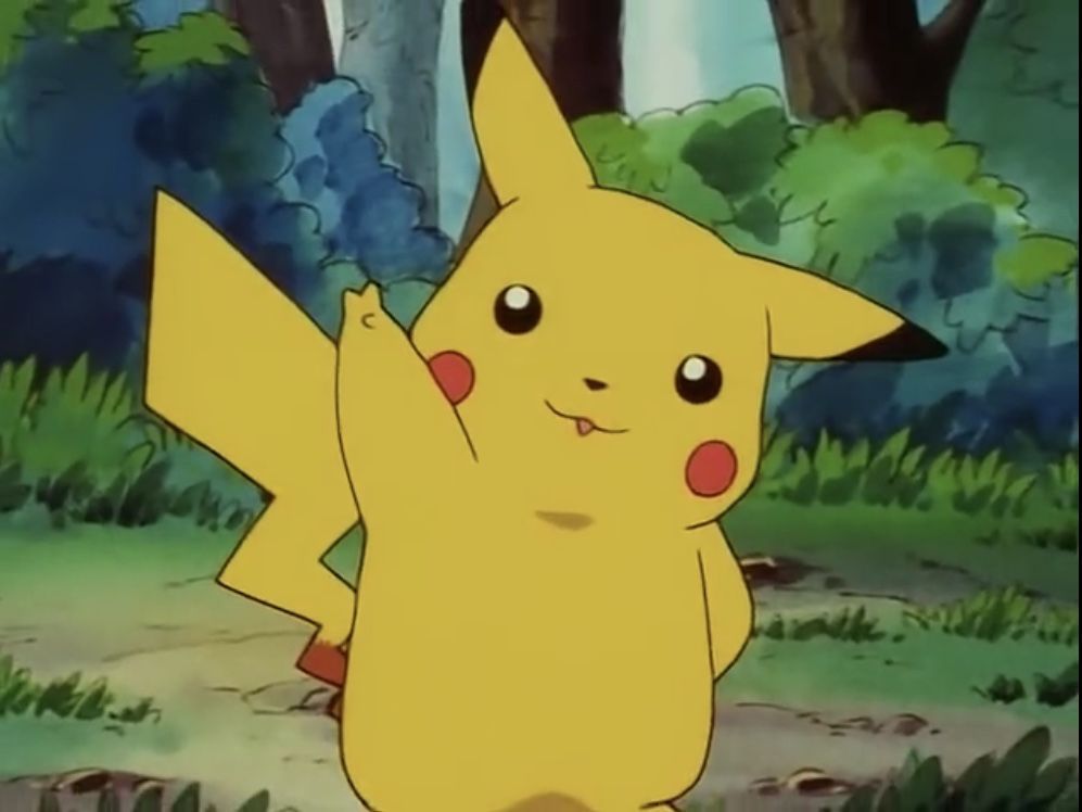 Screenshot of pikachu in the Pokémon anime doing a “peace” sign 
