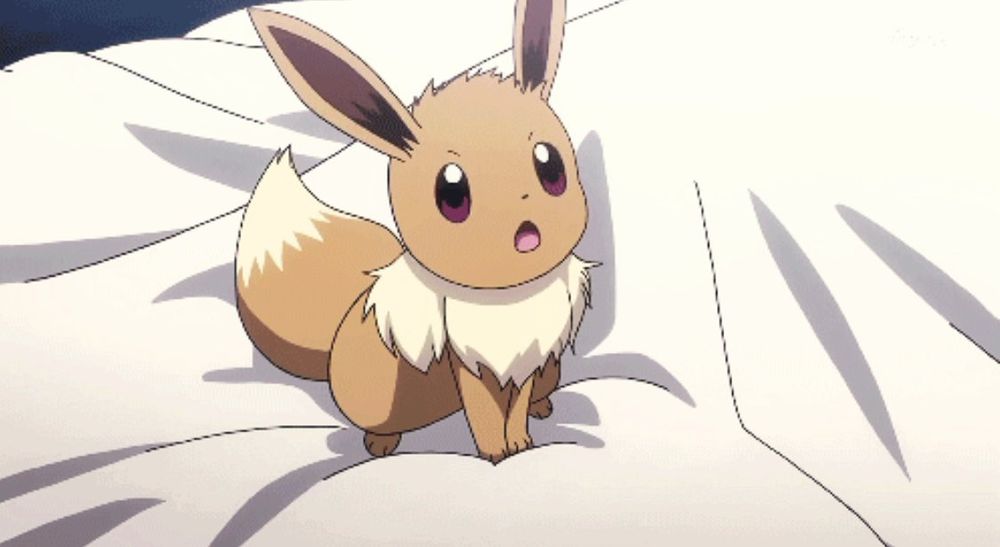 Screenshot of Eevee on a bed in the Pokémon anime 