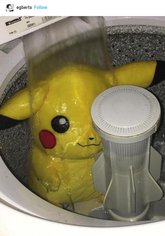 Photo of a giant Pikachu plush being cleaned in a washing machine 