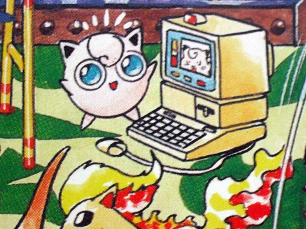 Photo of a Pokémon picture book showing jigglypuff talking to a clefairy through a computer 