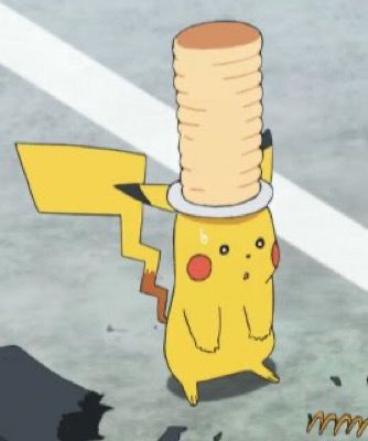 Screenshot of the Pokémon anime showing a shocked Pikachu with a plate of pancakes on his head 