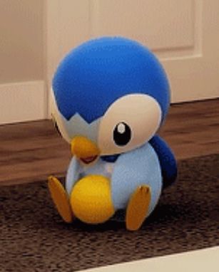 screenshot of a Pokémon animation showing a piplup playing with a yellow ball on a rug 