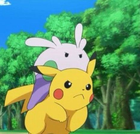 Screenshot of goomy riding on the back of Ash’s Pikachu as they are running away 