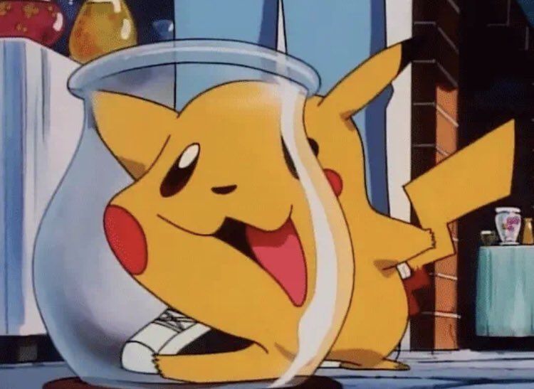 pikachu putting his face behind the glass face to his face look distorted and silly 