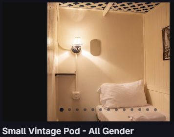 small vintage pod - all gender. white linens. awkward electrical conduit install