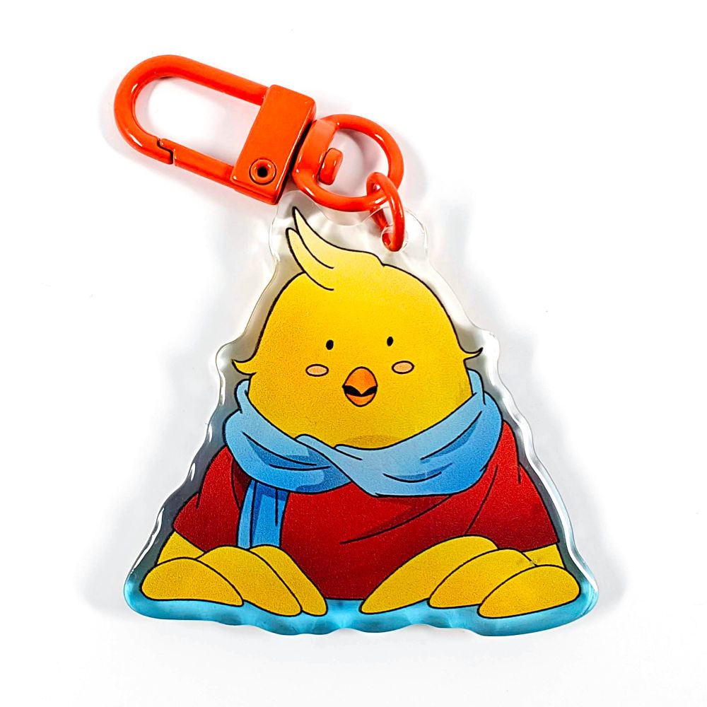 A picture of an acrylic keychain of Gyetang from Tower of God. He has his usual face with his half open beak and is wearing his classic outfit. The rim of the keychain is a gradient going from blue at the bottom to clear at the top. It has a bright orange clasp.