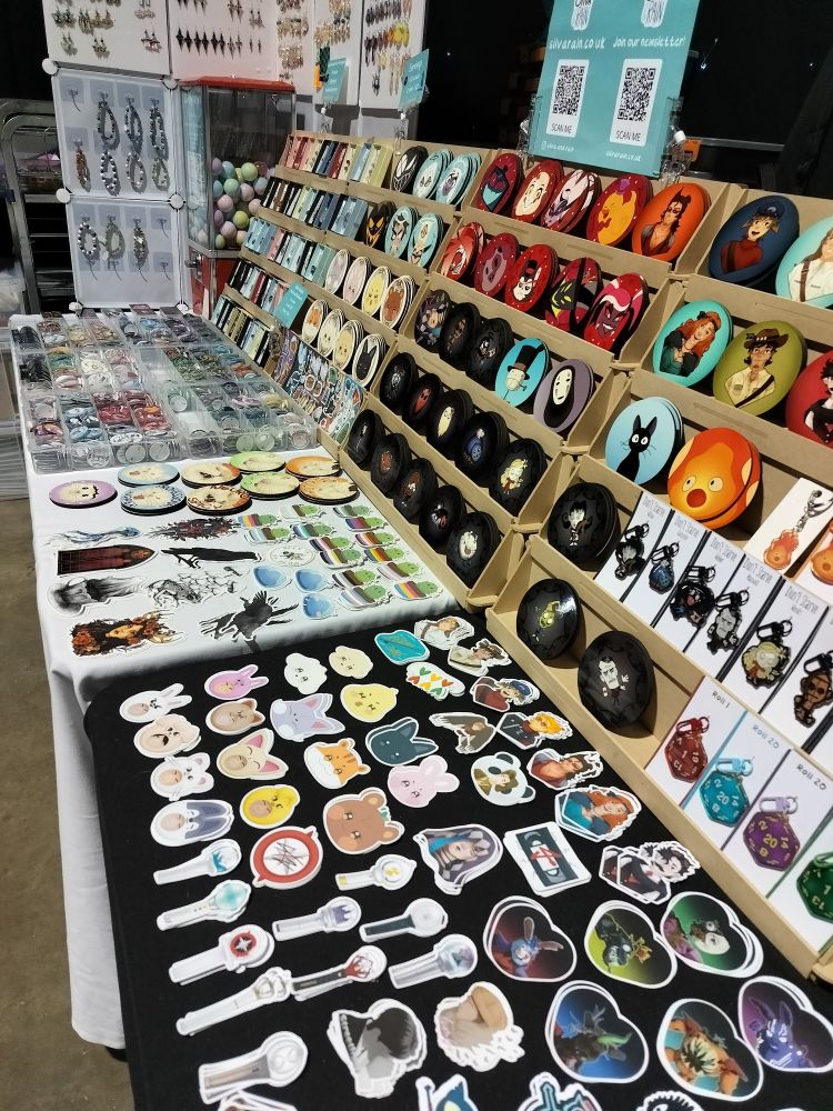 An angled close-up of the tables where you can see the stickers and coasters more closely.