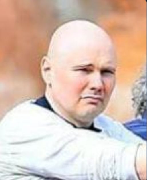 Sad, disappointed Billy Corgan at an amusement park