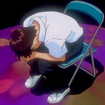 Image of Shinji from Neon Genesis Evangelion sitting in a chair, hunched over with his hands clasped