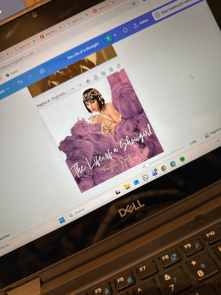 A picture of my laptop screen opened on canva and it’s a project where I recreate Taylor swift album covers but with the life of a showgirl theme. This is speak now 
