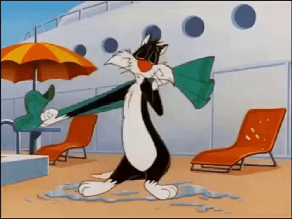 sylvester the cat from looney tunes is holding an umbrella and a towel while walking on a beach .