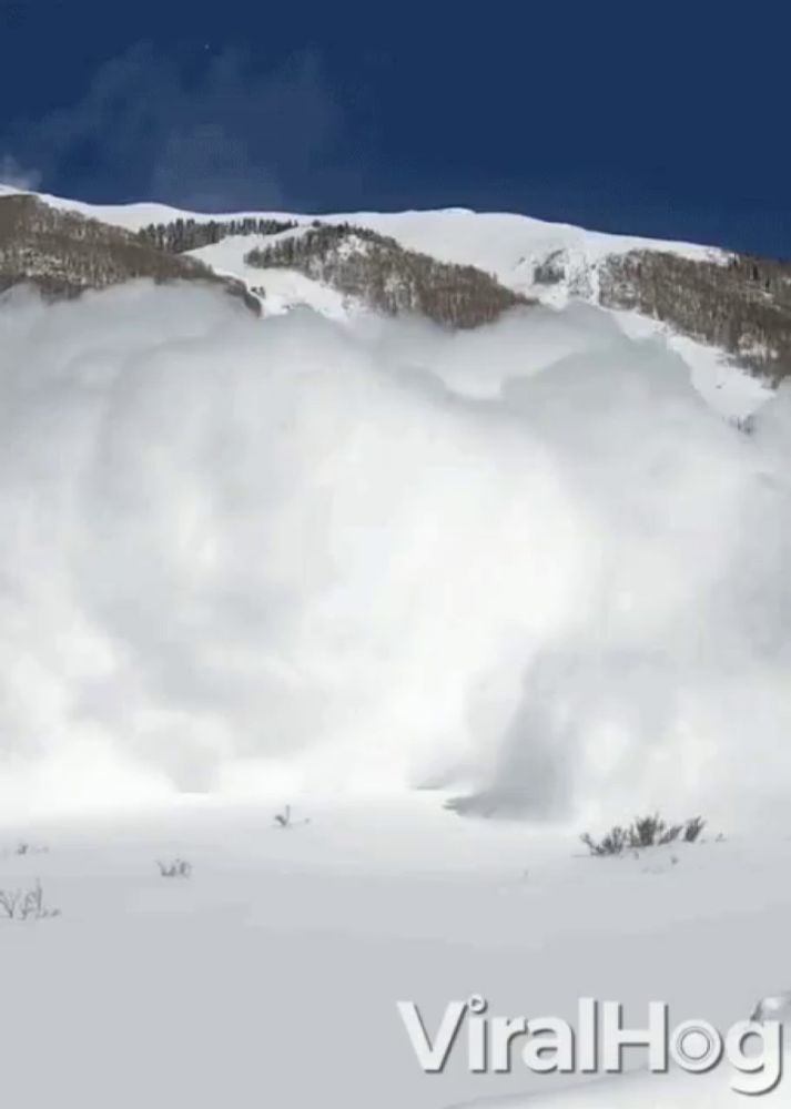 a snowy mountain with the words viralhog on the bottom right