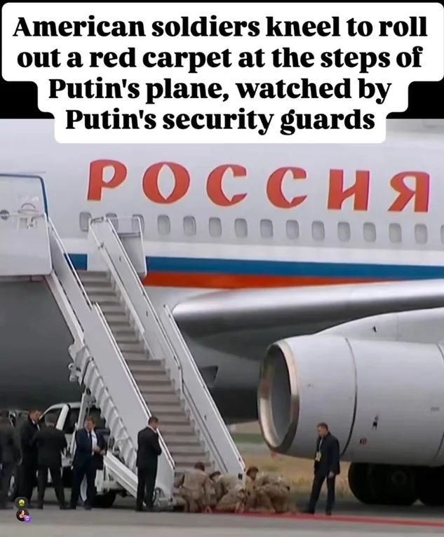 Photo of American soldiers on their hands and knees, rolling out a red carpet to Putin's jet. The text overhead says, "American soldiers kneel to roll out a red carpet at the steps of Putin's plane, watched by Putin's security guards" 