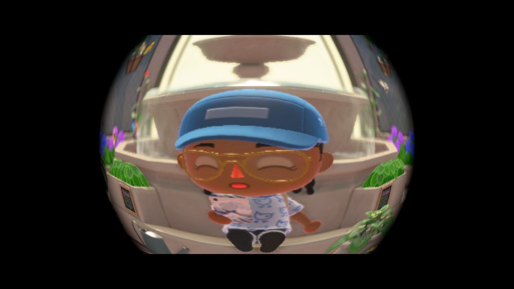 fish eye filter over my animal crossing new horizons villager sitting in front of a fountain