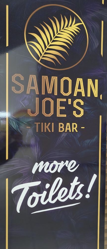 An advert with the words "Samoan Joe's Tiki Bar - MORE TOILETS"