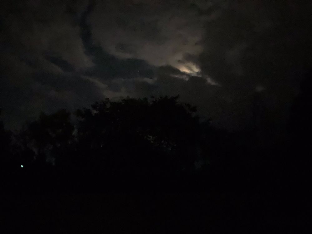 Moonlight peeking out between clouds