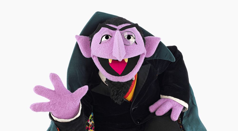 Count von Count from Sesame Street, a purple skinned muppet with vampire teeth and pointed ears (who is quite harmless).