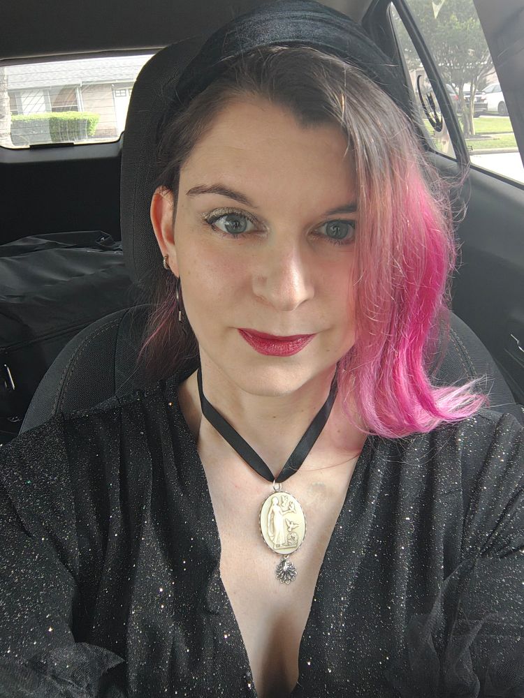 Car selfie, white femme presenting person with pink hair in an amazing black glittery dress from #ellerebel and a beautiful necklace from Etsy shop TorchAndArrow 