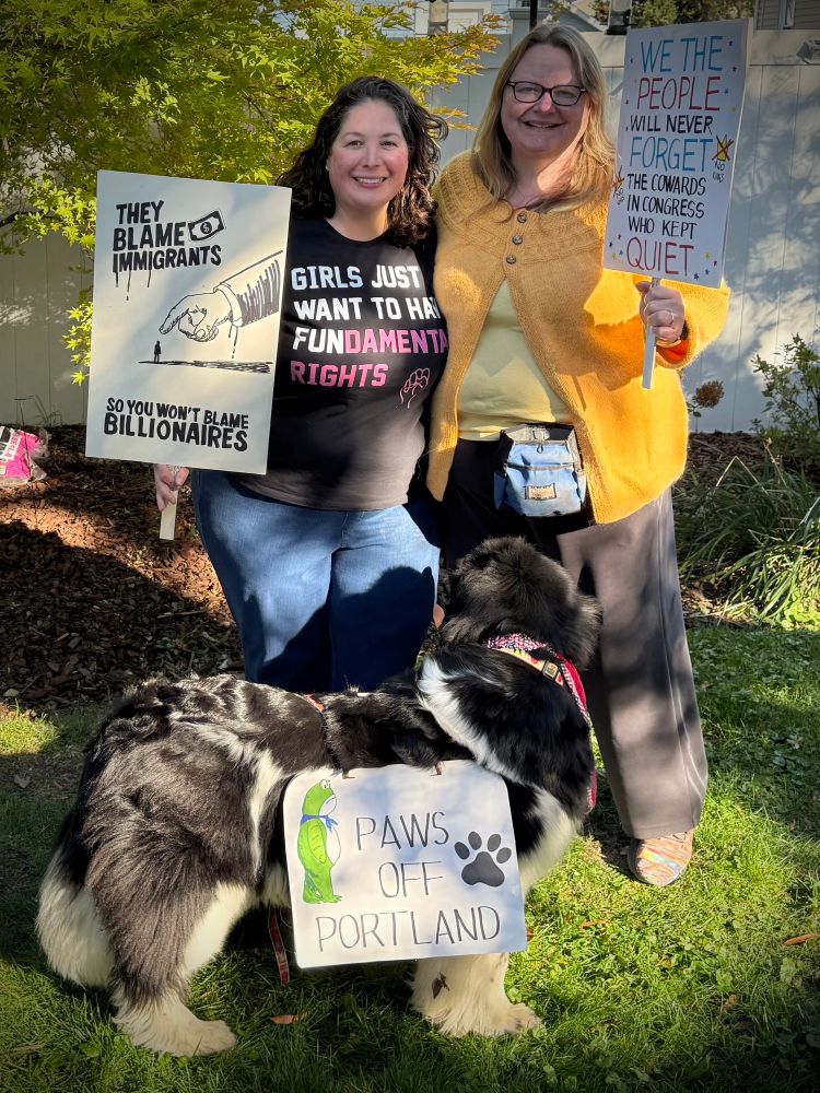 Protesters with signs. Dog with protest signs. 