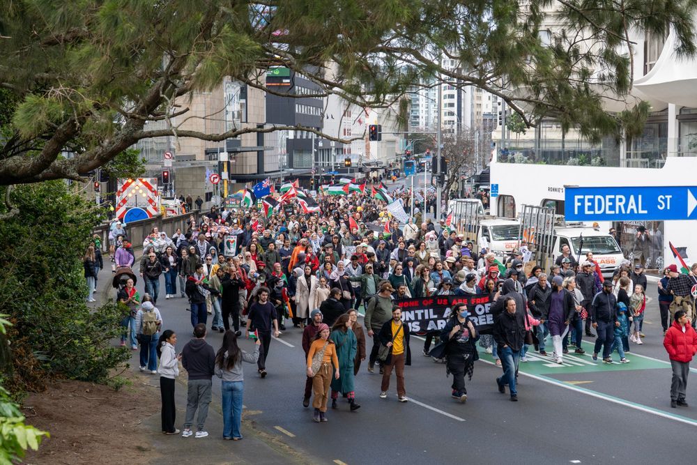 Further away shot of crowd and federal street shot