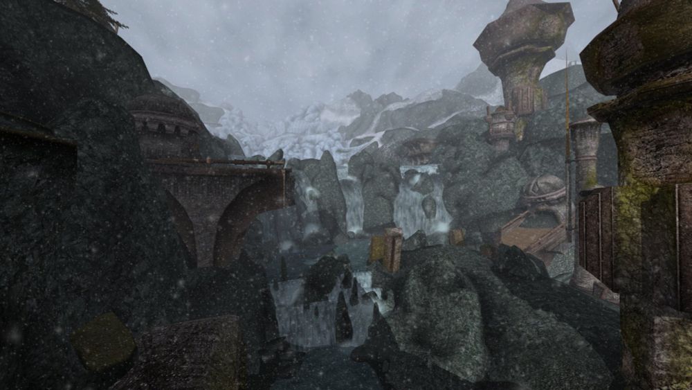 Snow drifts as glacial waterfalls crash through this dilapidated Dwemer pass.