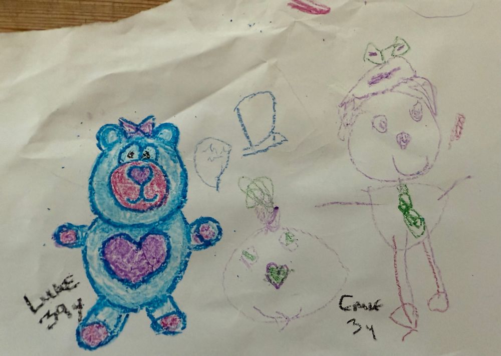 Drawing of a blue, purple and white cartoon bear and other characters by me, Luke, 39yo and my daughter 3yo