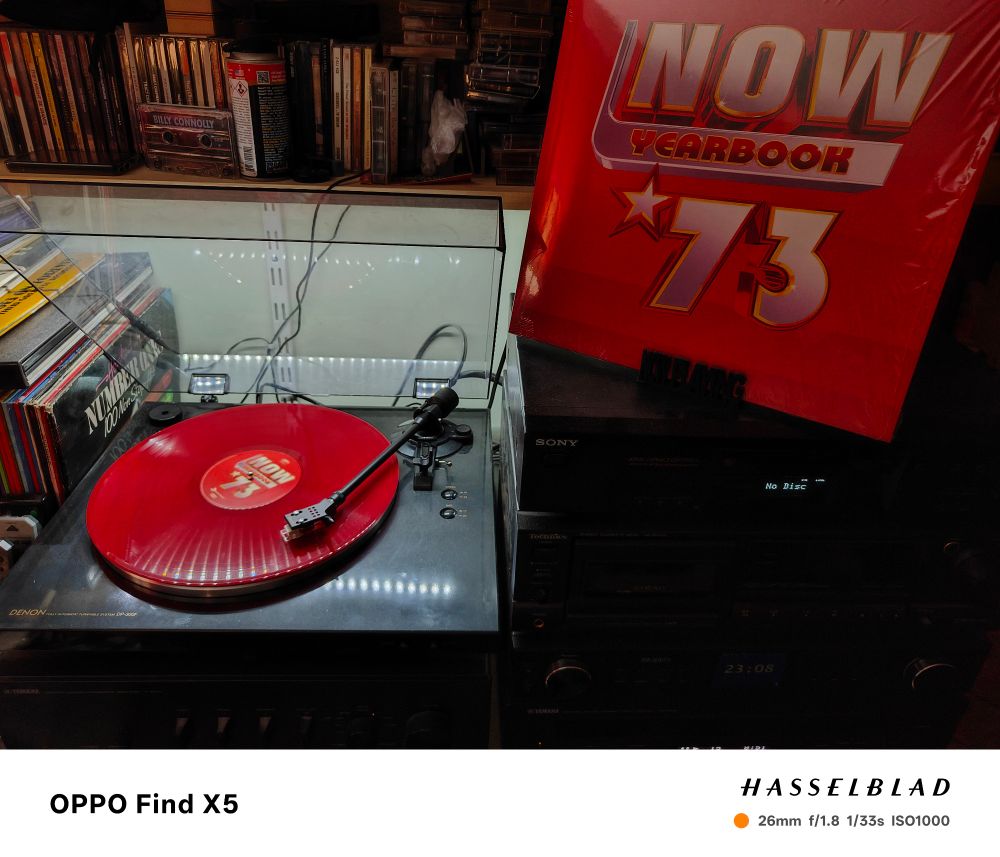 A turntable spins some shockingly red vinyl from the 