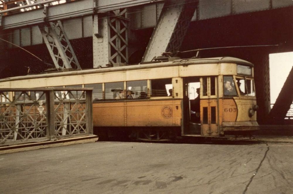 Roosevelt Island was once accessed through a trolley station in the middle of the Queensboro Bridge, from 1909 to 1957. The trolly was orange and yellow.