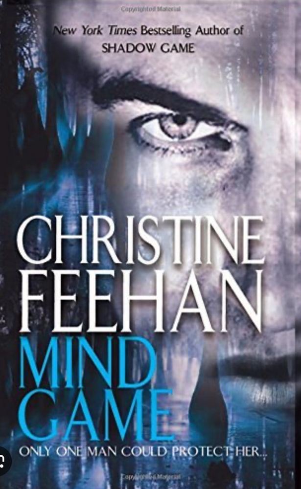 Mind Game by Christine Feehan book cover. Man staring out with rain coming down his face. 