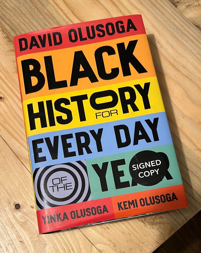A multi-coloured book cover with the title “Black History for Every Day of the Year”. Authors are David Olusoga, Yinka Olusoga and Kemi Olusoga. 