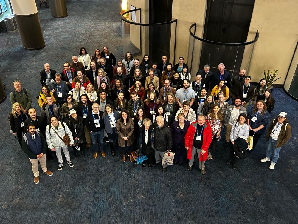Group photo of approximately 75 of the CowanFest attendees taken from above.