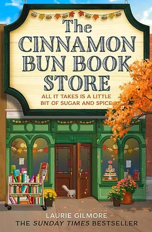 Cover of The Cinnamon Bun Book Store by Laurie Glmore.
Image shows the front of the book store.  There is a cart of books in front of the windows, the front door is open and there is acat walking into the store.  There are baked goods in another window. Some potted flowers and a branch of a tree with the leaves starting to turn orange. 
