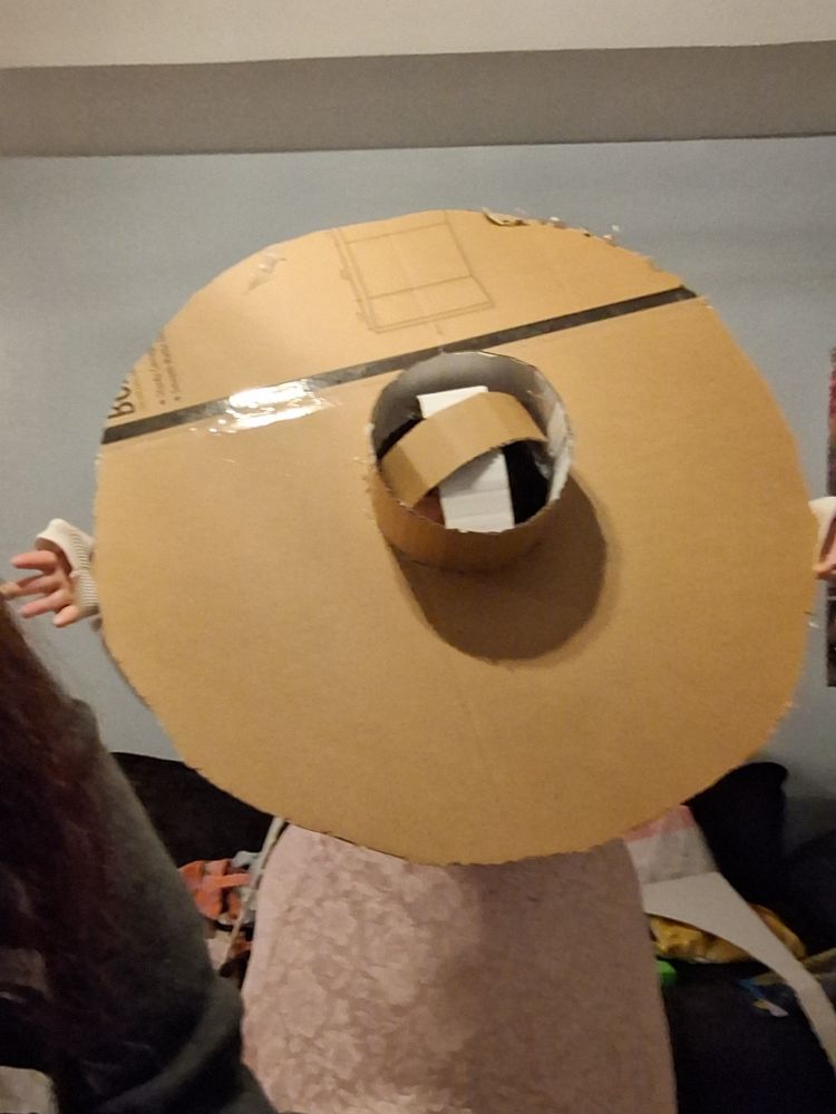 The top of a hat made of cardboard 
