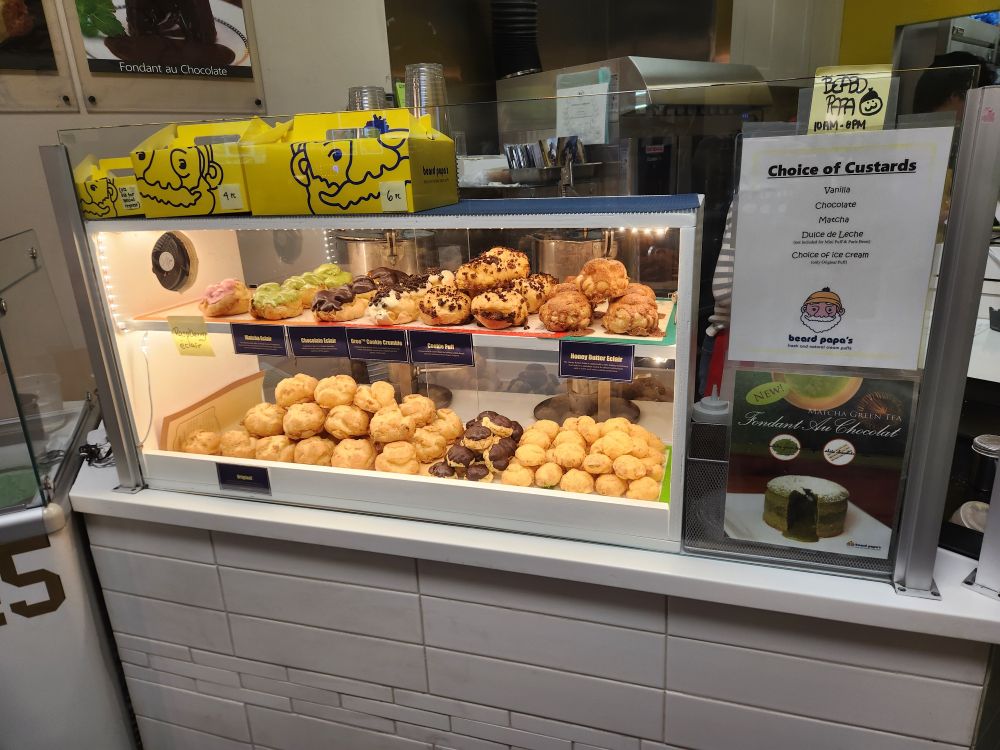A picture of the pastry case at Beard Papa's.