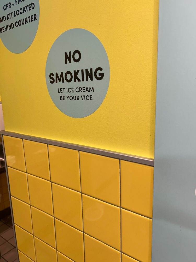 Sign on wall that says “No Smoking. Let ice cream be your vice.”