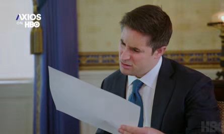 Jonathan Swan looking at a paper, confused