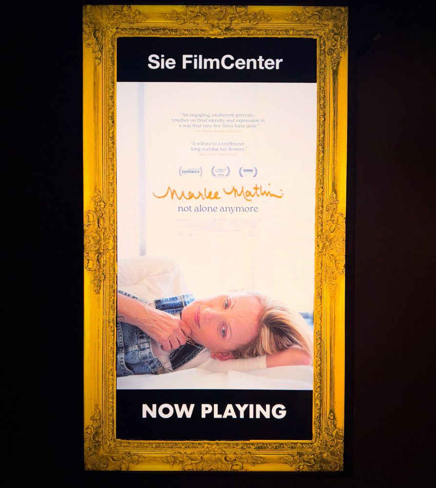 Movie poster of Marlee Matlin: Not Alone Anymore. Woman laying down facing POV 