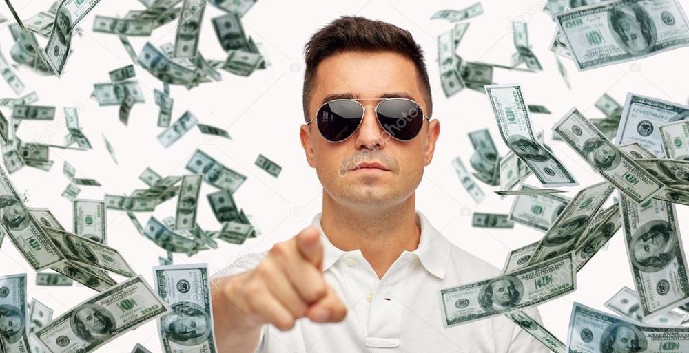 Stock photo titled "Man pointing on you with falling dollar money" (a guy in aviator sunglasses and a white polo shirt points at the camera, surrounded by a flurry of $100 bills)