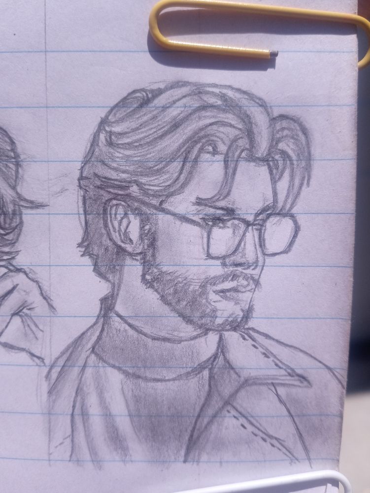 Pencil sketch of a man with medium-length wavy hair, a beard, and rectangular glasses. He wears a jacket over a turtleneck, looking slightly to the right with a serious expression